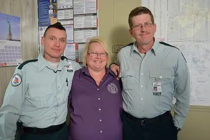 Pictured L-R; EMT Jay Edwards, Carol Carrol, and Paramedic Christopher Crawshaw